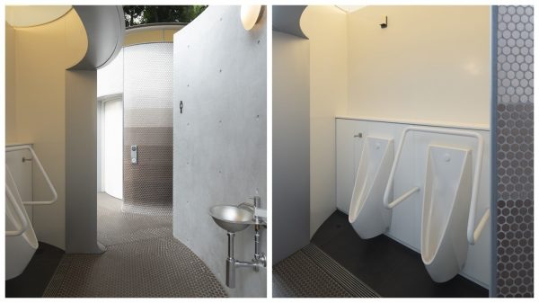 The bathroom is equipped with a wall-hung urinal with a built-in sensor flush valve.